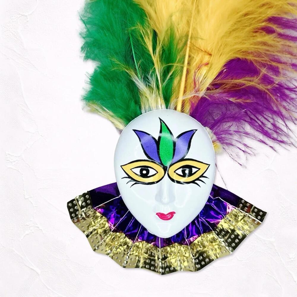 6440. Creepy Mardi Gras Brooch